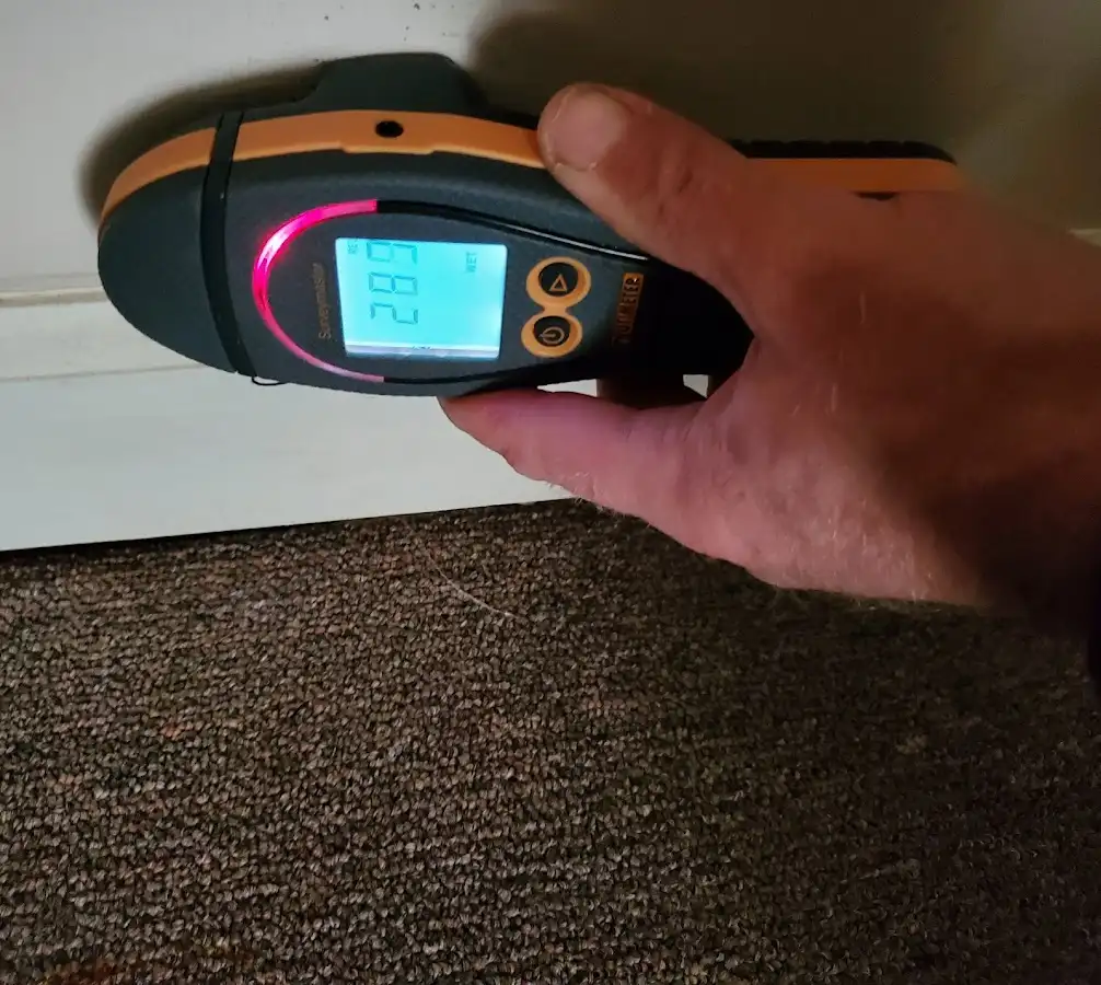 Moisture detection at baseboard during Storm Damage Restoration in Totowa